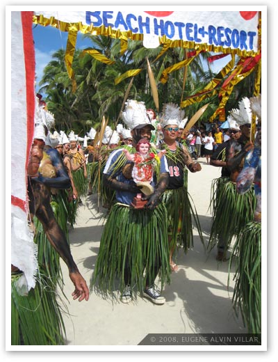  Picture of Ati-atihan paraders wearing grass skirts.